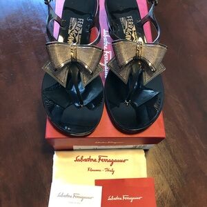 Salvatore Ferragamo Black and Gold Bow Sandals